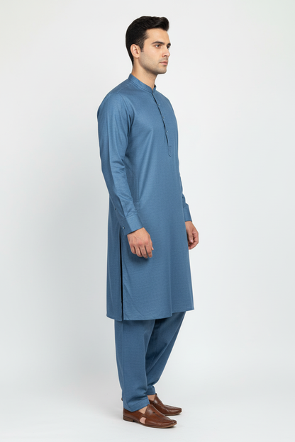 Side view of blue merino wool shalwar kameez on model
